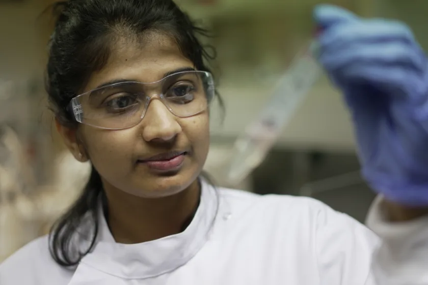 Woman holding a testtube.